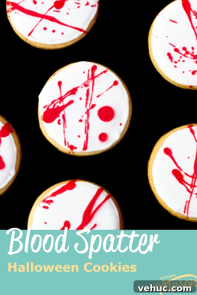Blood-Spattered Halloween Cookie Ideas for a Spooky Party 2 Flat lay view of lots of blood spatter halloween cookies lay on a black backdrop.