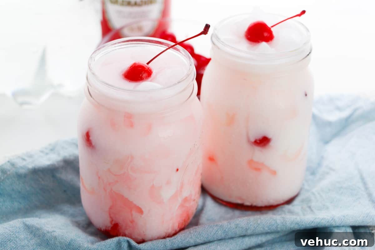 Shirley Temple Dirty Soda Recipe — Sparkling Cherry Lime Mocktail 6 Shirley temple dirty sodas garnished with cherries in two mason jars.