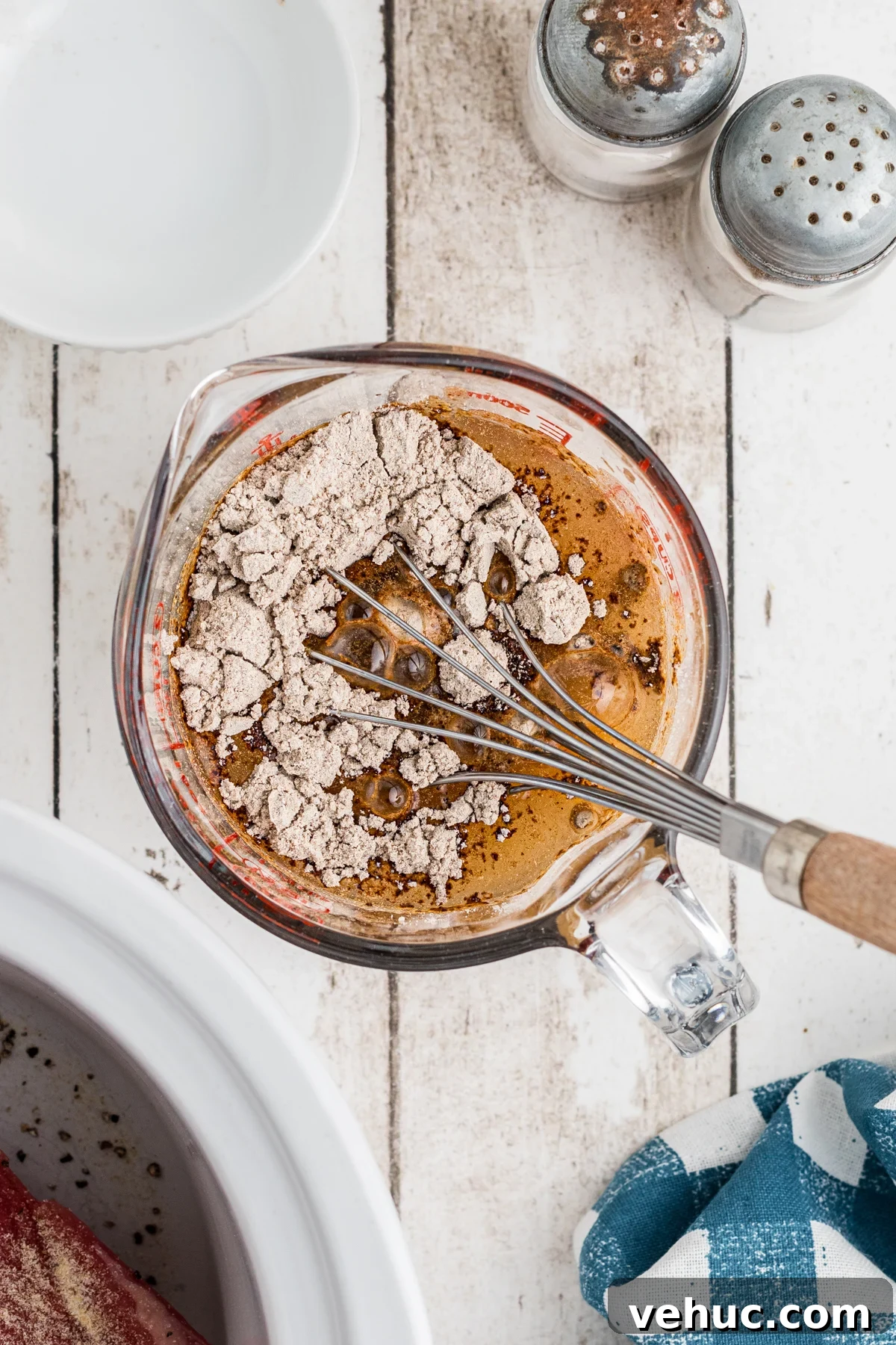 IN a bowl mix together the gravy mix and water together