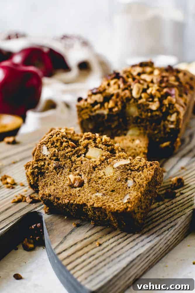 This densely soft Cinnamon Apple Bread is filled with fall flavor and packed with sweetened apples and walnuts. Serve this easy-to-make treat with breakfast or for a snack. cinnamon apple bread