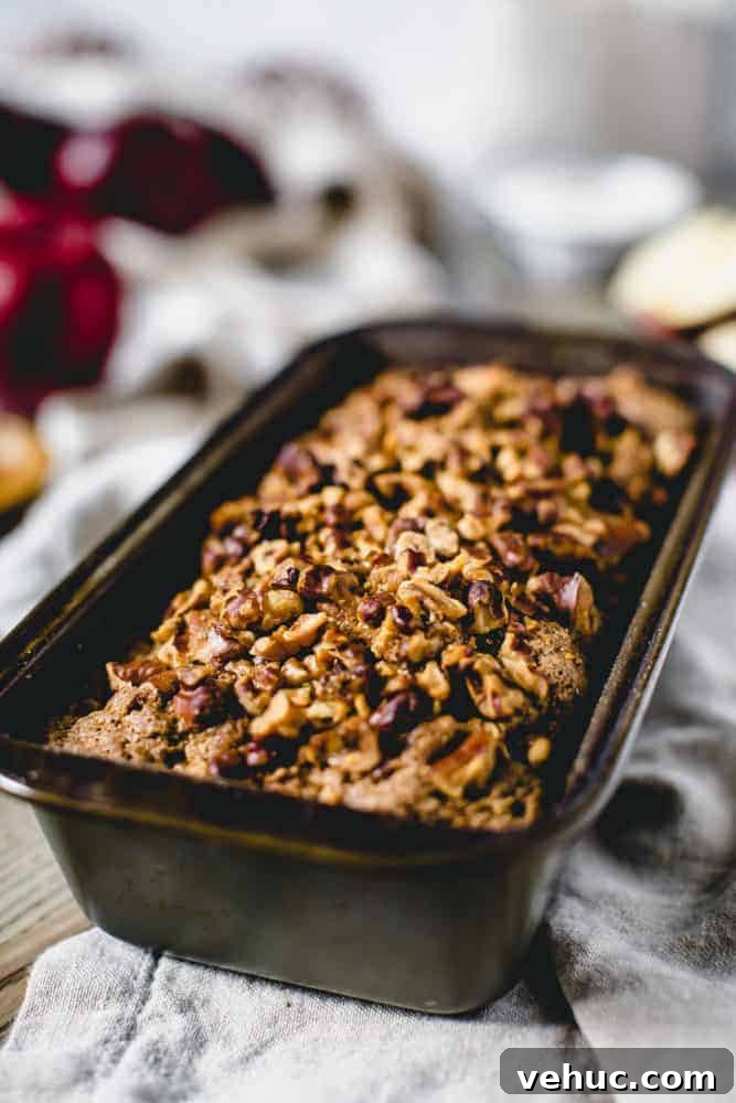 This densely soft Cinnamon Apple Bread is filled with fall flavor and packed with sweetened apples and walnuts. Serve this easy-to-make treat with breakfast or for a snack. cinnamon apple bread