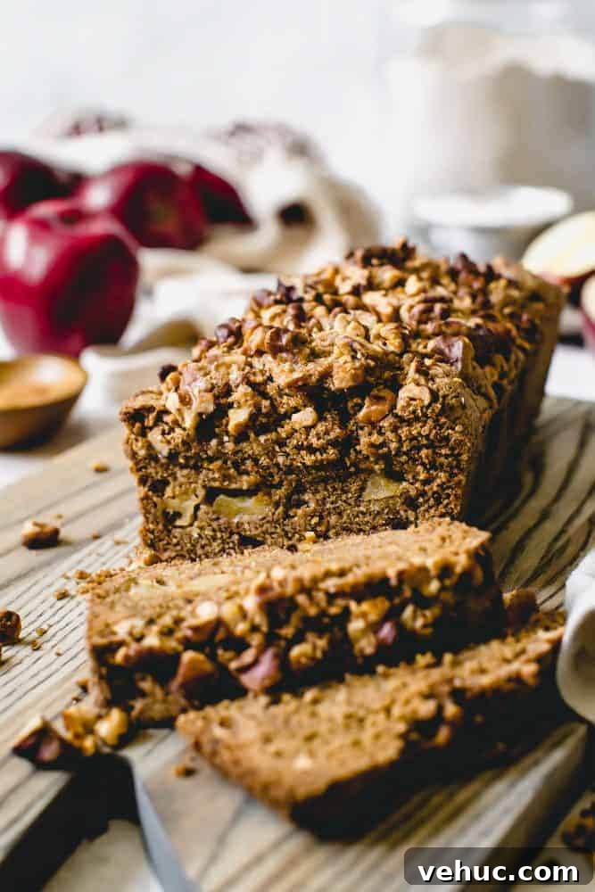 This densely soft Cinnamon Apple Bread is filled with fall flavor and packed with sweetened apples and walnuts. Serve this easy-to-make treat with breakfast or for a snack. cinnamon apple bread