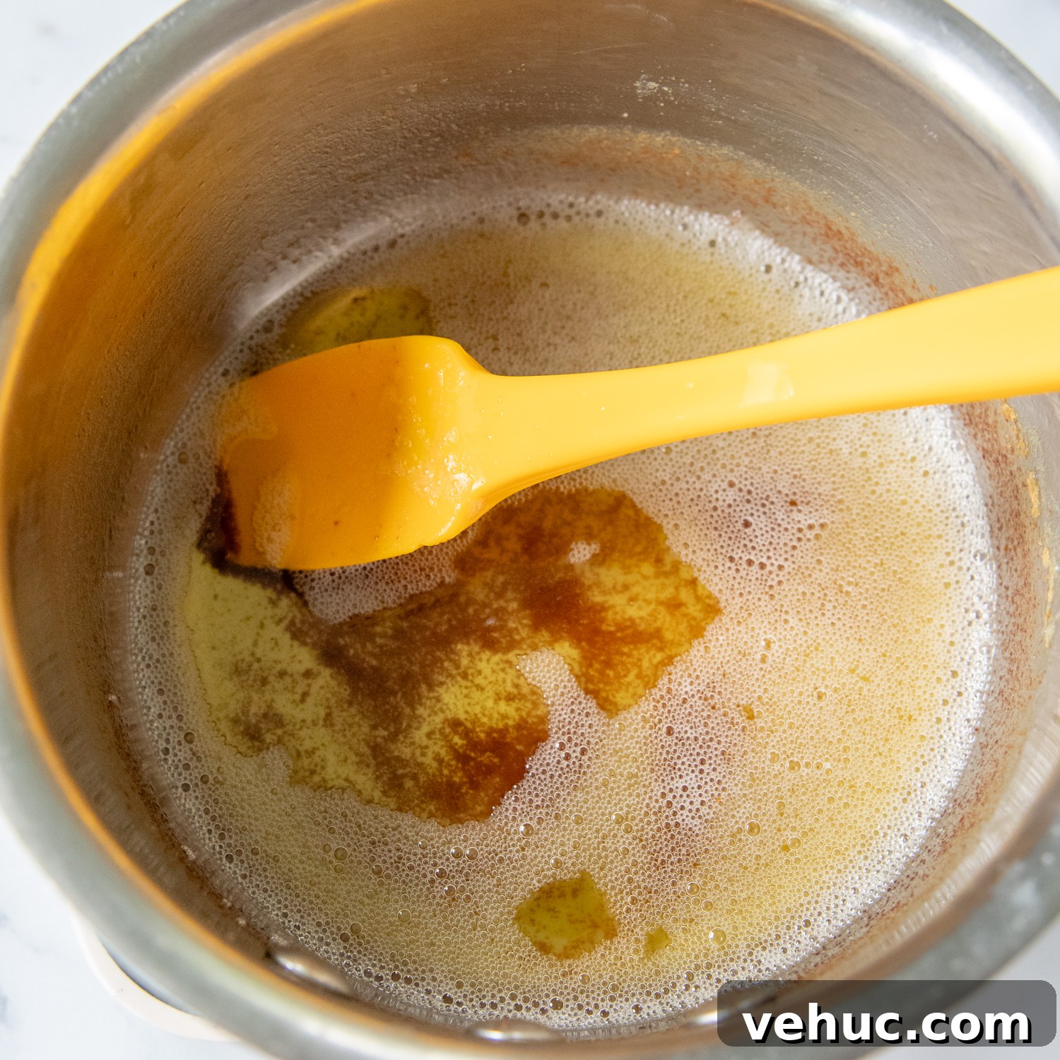 Gluten-Free Banana Bars with Creamy Frosting 5 a small saucepan with melted browned butter.