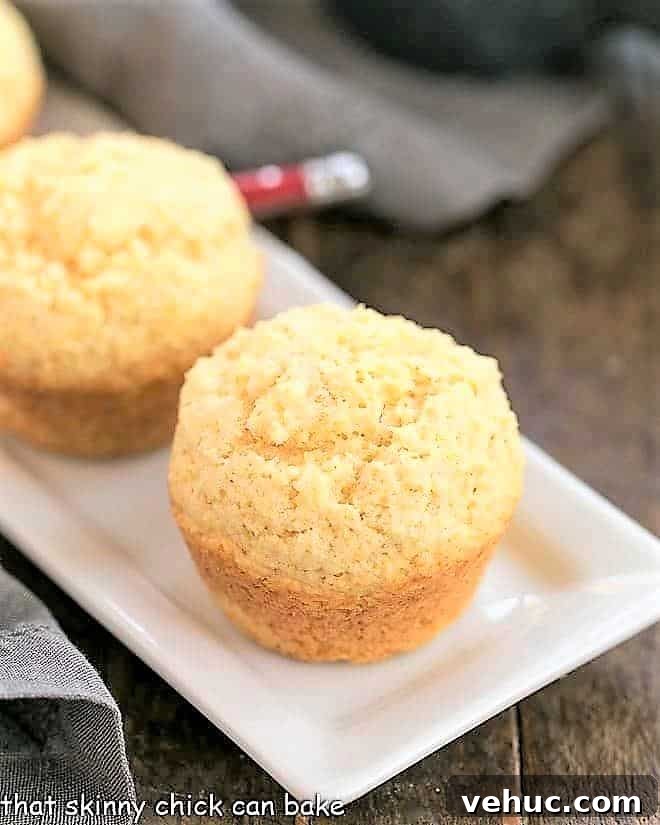 Buttermilk Corn Muffins - Tender from the buttermilk with a touch of sweetness! Buttermilk Corn Muffins on a rectangular, white tray.