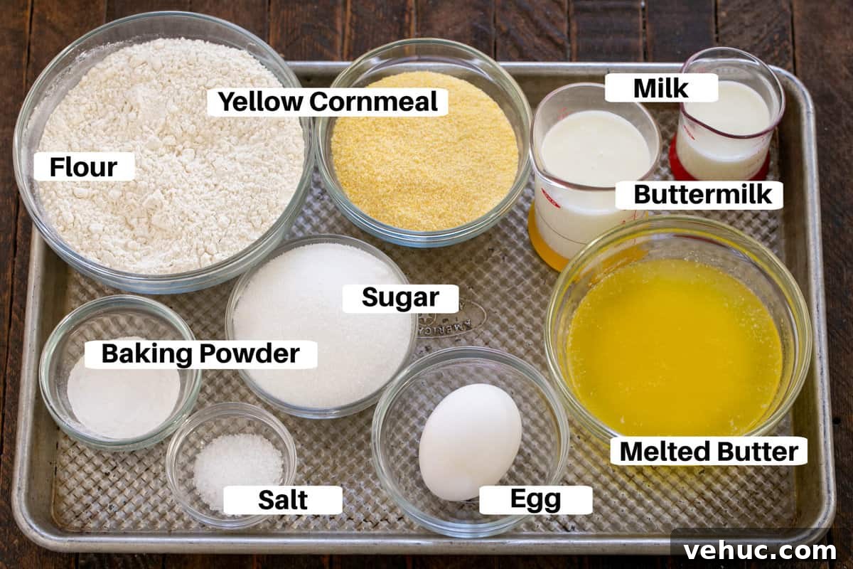 Moist Buttermilk Corn Muffins Recipe for Perfect Breakfast 2 Buttermilk Corn Muffin Ingredients on a metal sheet pan with labels.