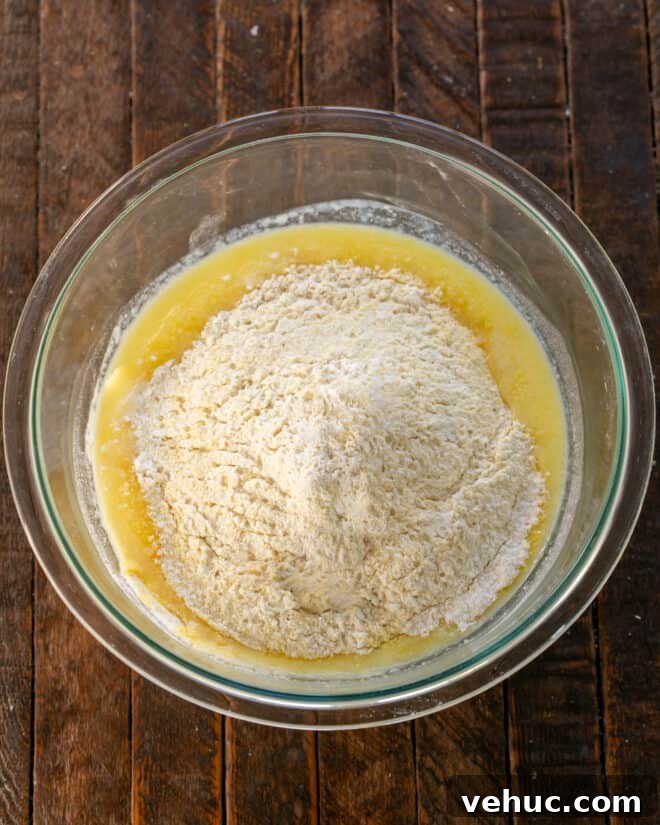 Moist Buttermilk Corn Muffins Recipe for Perfect Breakfast 5 Dry ingredients added to bowl.