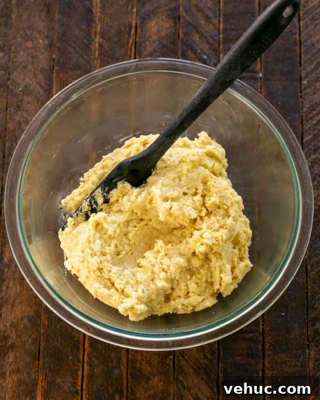 Moist Buttermilk Corn Muffins Recipe for Perfect Breakfast 6 Dry ingredients mixed into wet ingredients.