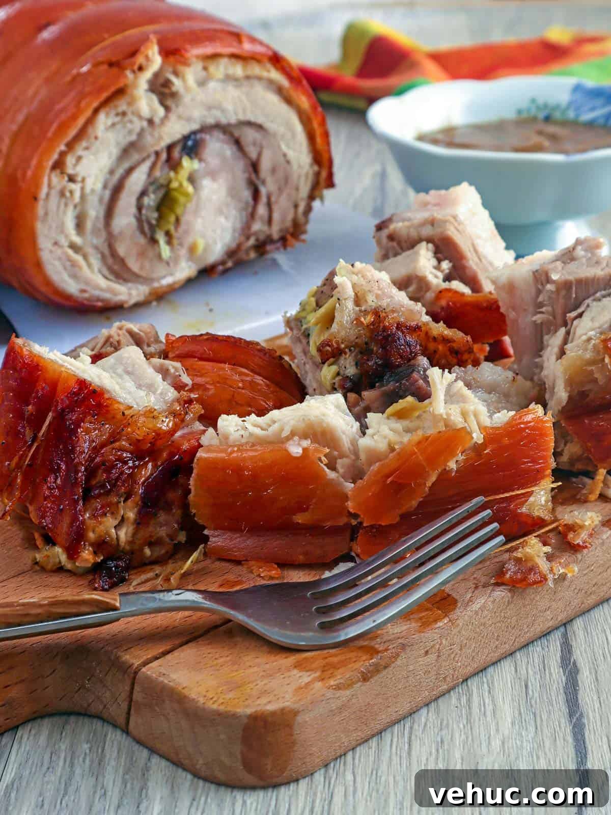 Crispy Pork Belly Lechon Roll Recipe: Filipino-Style Roast Pork 2 lechon pork belly on a cutting board