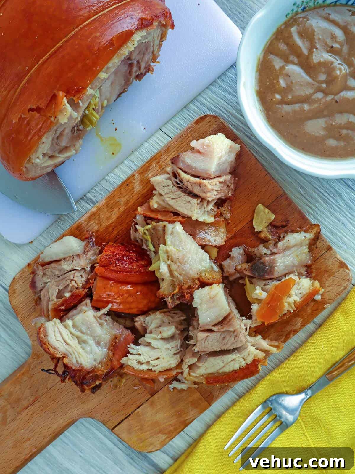 Crispy Pork Belly Lechon Roll Recipe: Filipino-Style Roast Pork 8 chopped up Pork Belly Lechon Roll on a cutting board