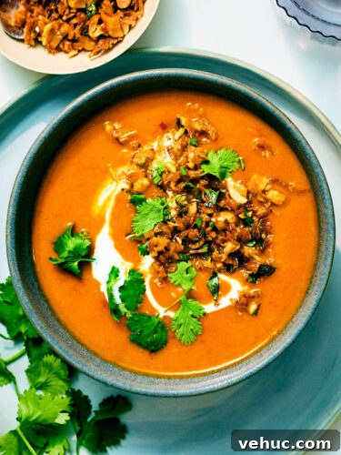Creamy Kabocha Squash and Coconut Milk Soup — No Blender Needed 15 Vegan Kabocha Squash Soup with Coconut Milk in a bowl with Peanut Lime Crunch.