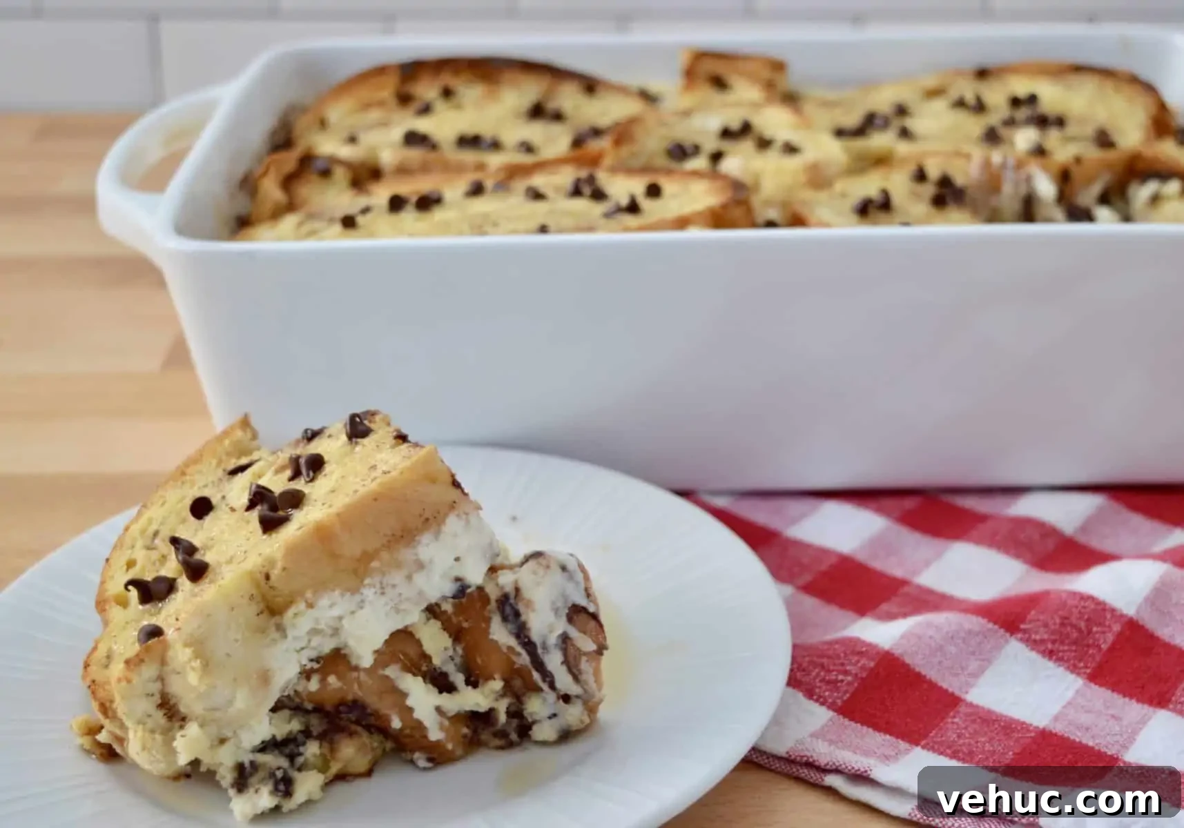 Baked Cannoli French Toast Recipe for a Sweet Brunch 3 Slice of cannoli baked French toast on a plate.