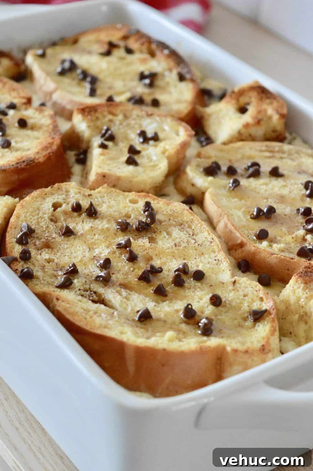 Baked Cannoli French Toast Recipe for a Sweet Brunch 4 Cannoli Baked French Toast in a white casserole dish.