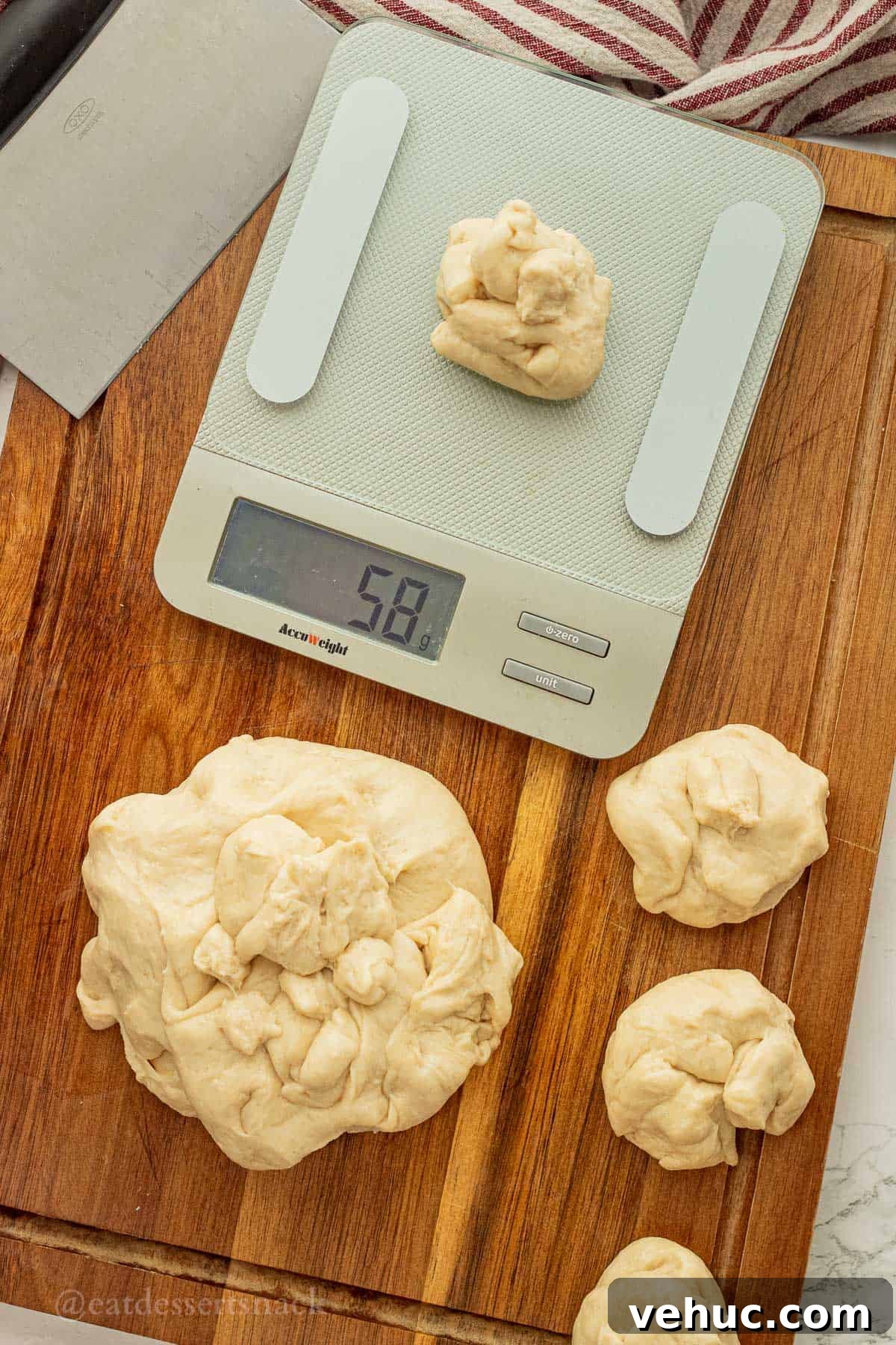 Classic Old-Fashioned Yeast Rolls Recipe 7 Scale with raw roll dough on top, with cutting board and roll dough sectioned into balls.