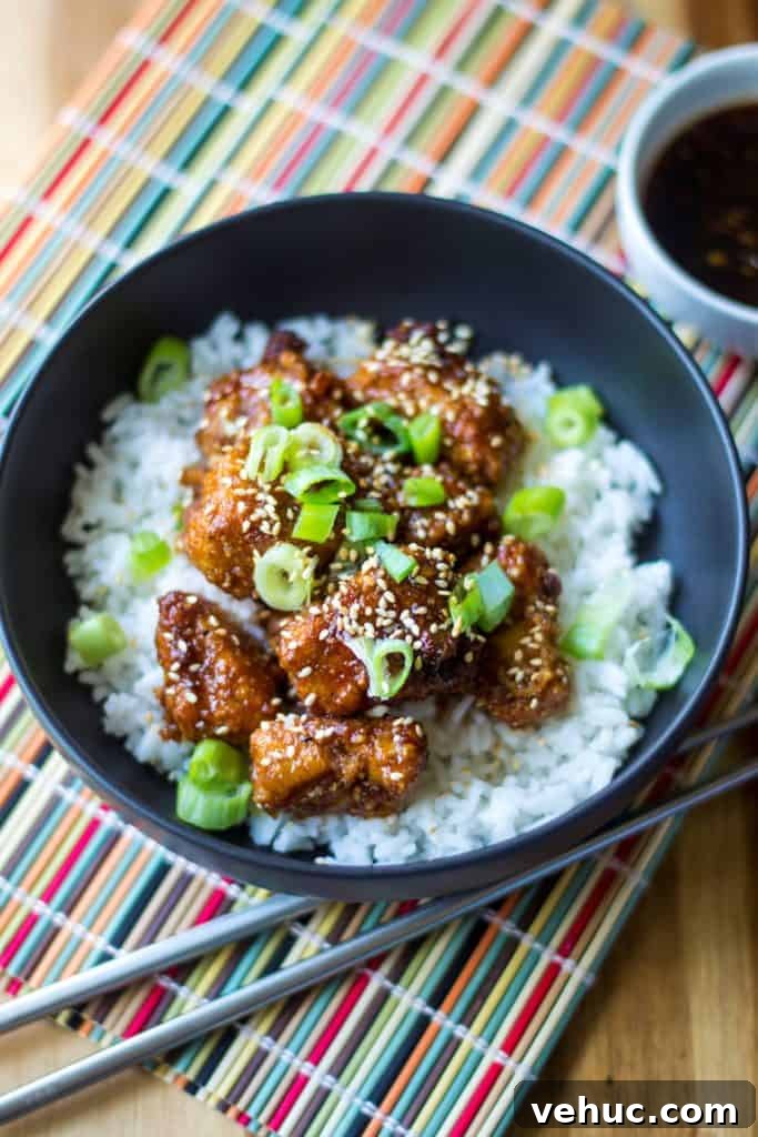 Sticky Chicken Rice Bowl is the perfect combination of tender rice and baked chicken bites covered in a thick sticky sauce.