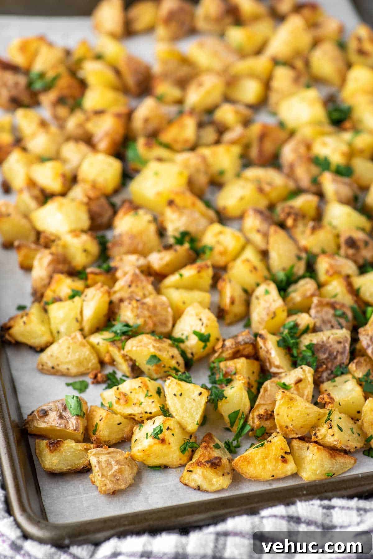 Crispy roasted potatoes in baking sheet.