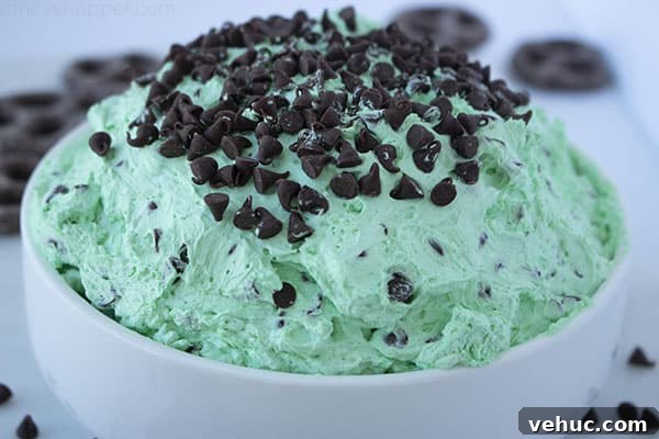 Overflowing bowl of green mint cheesecake dip