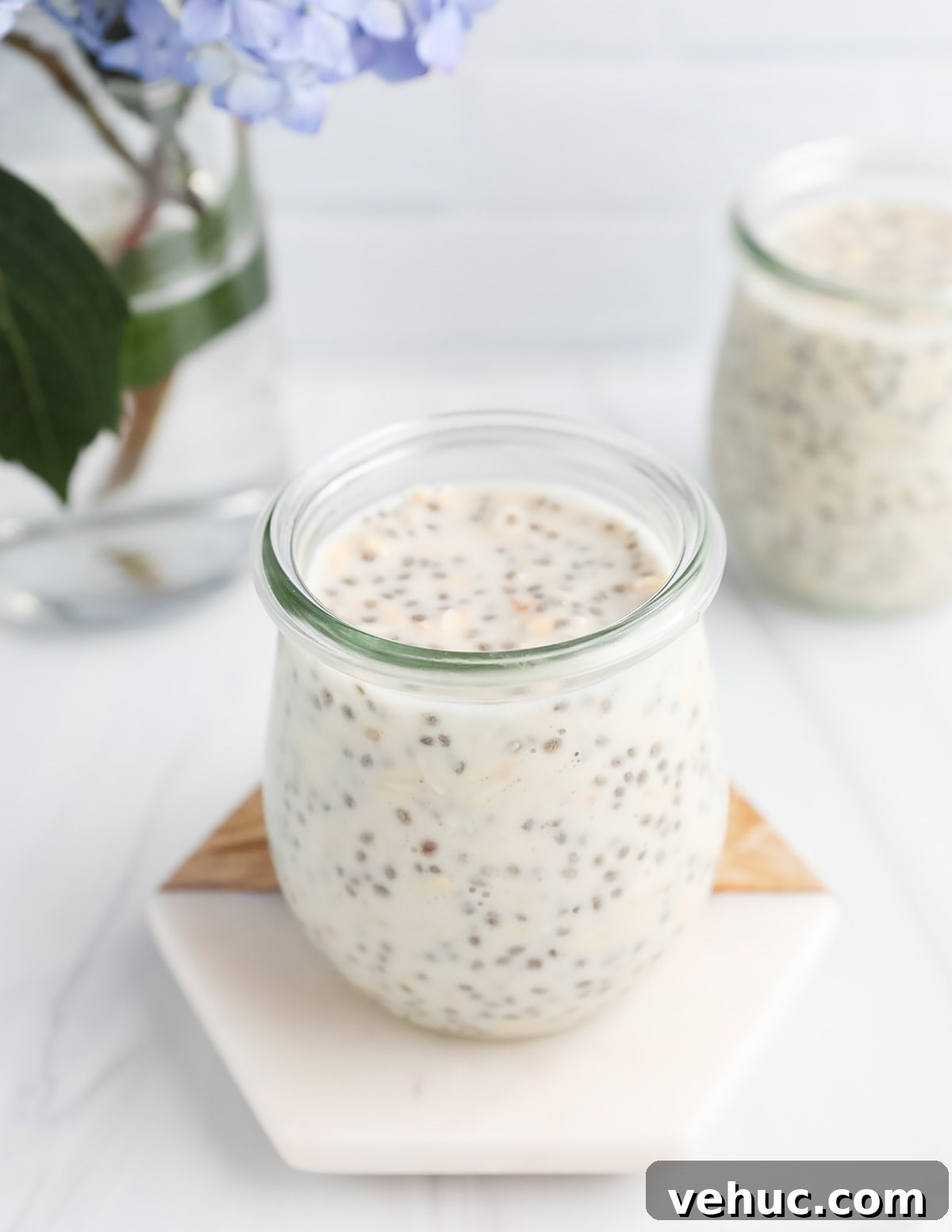 Creamy Vanilla Overnight Oats Recipe for Busy Mornings 4 A clear jar filled with vanilla chia seed overnight oatmeal.
