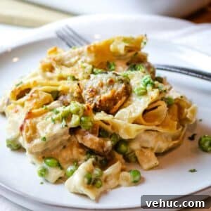Tuna Noodle Casserole from Scratch (No Canned Soup) 13 tuna noodle casserole on white plate.