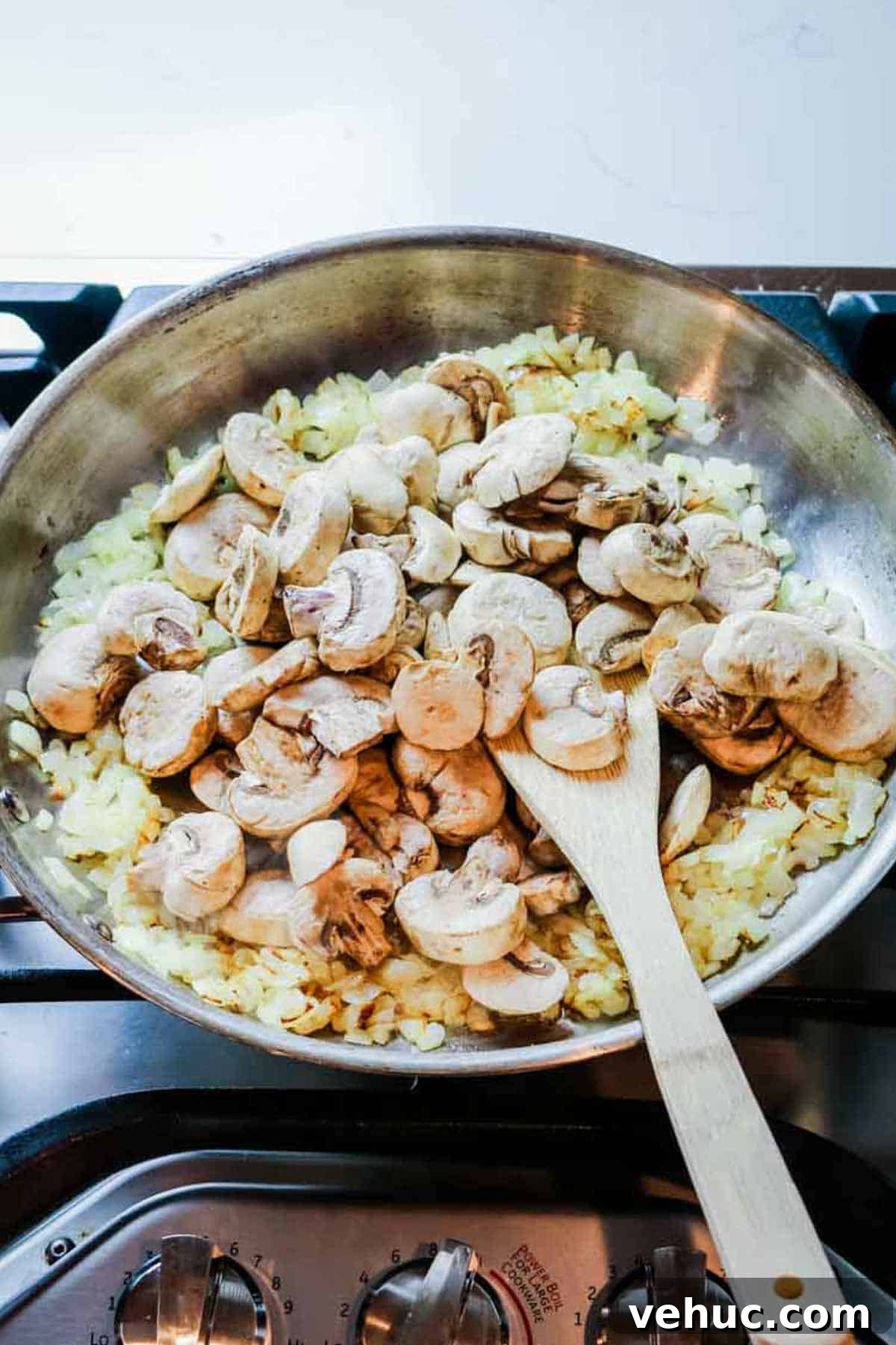 Tuna Noodle Casserole from Scratch (No Canned Soup) 6 onions and mushrooms sauteed in stainless steel skillet.