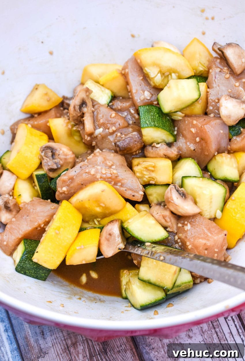 Air Fryer Hibachi-Style Chicken and Vegetables Recipe 4 air fryer hibachi chicken and vegetables ingredients in a large mixing bowl