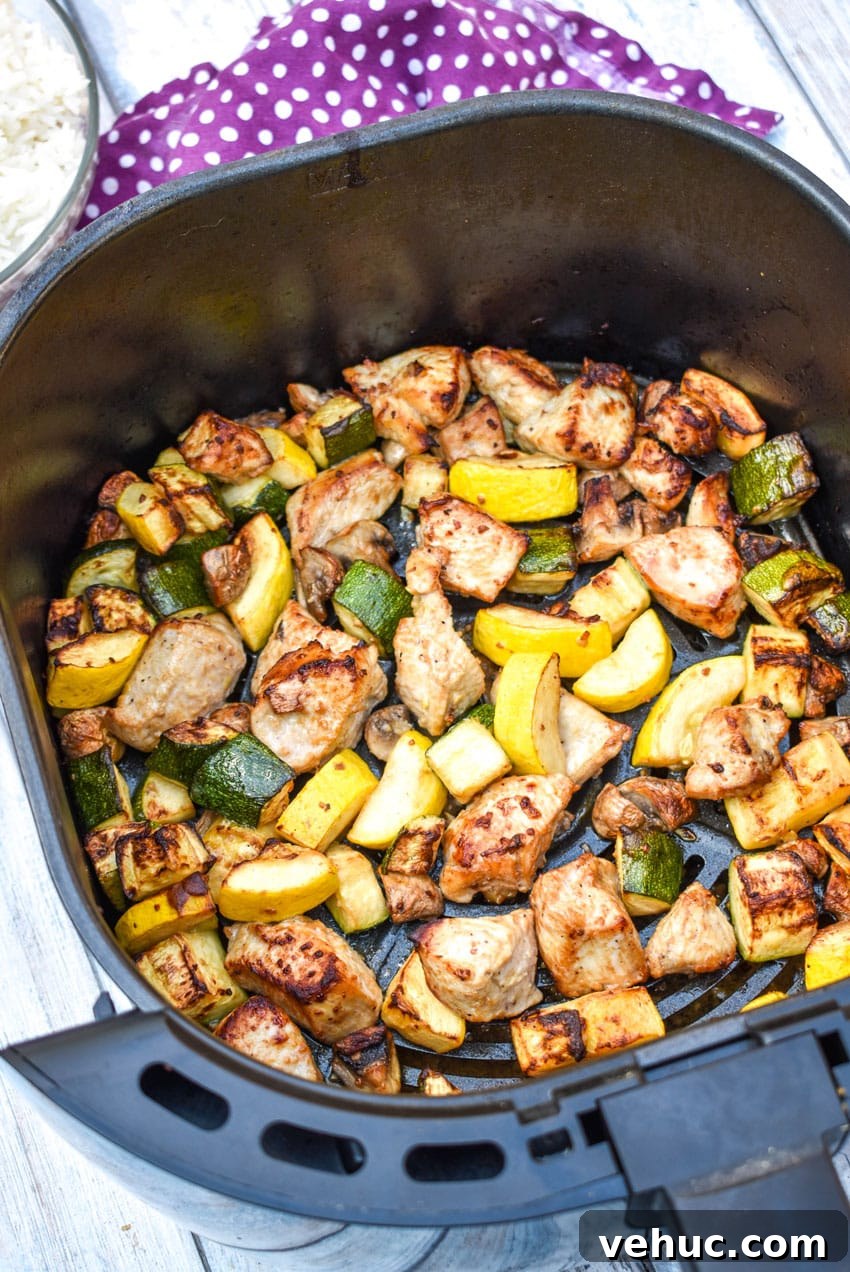 Air Fryer Hibachi-Style Chicken and Vegetables Recipe 6 easy homemade hibachi chicken and vegetables in the basket of an air fryer