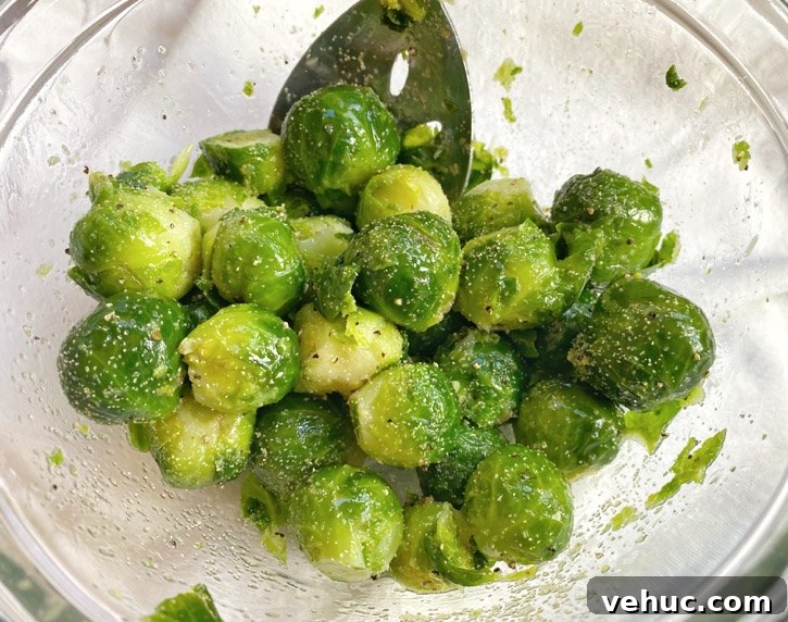 Crispy Smashed Brussels Sprouts with Garlic and Parmesan 5 Toss Brussels sprouts with olive oil and seasoning.