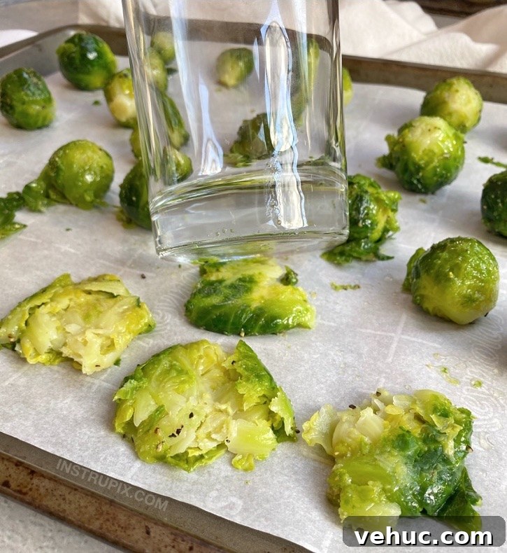 Crispy Smashed Brussels Sprouts with Garlic and Parmesan 6 Smash Brussels sprouts with the bottom of a cup.