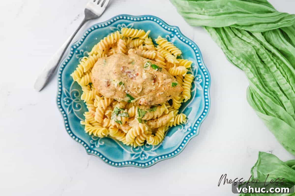 Crockpot Marry Me Chicken Recipe for Tender, Creamy Flavor 13 crockpot chicken and pasta on blue plate