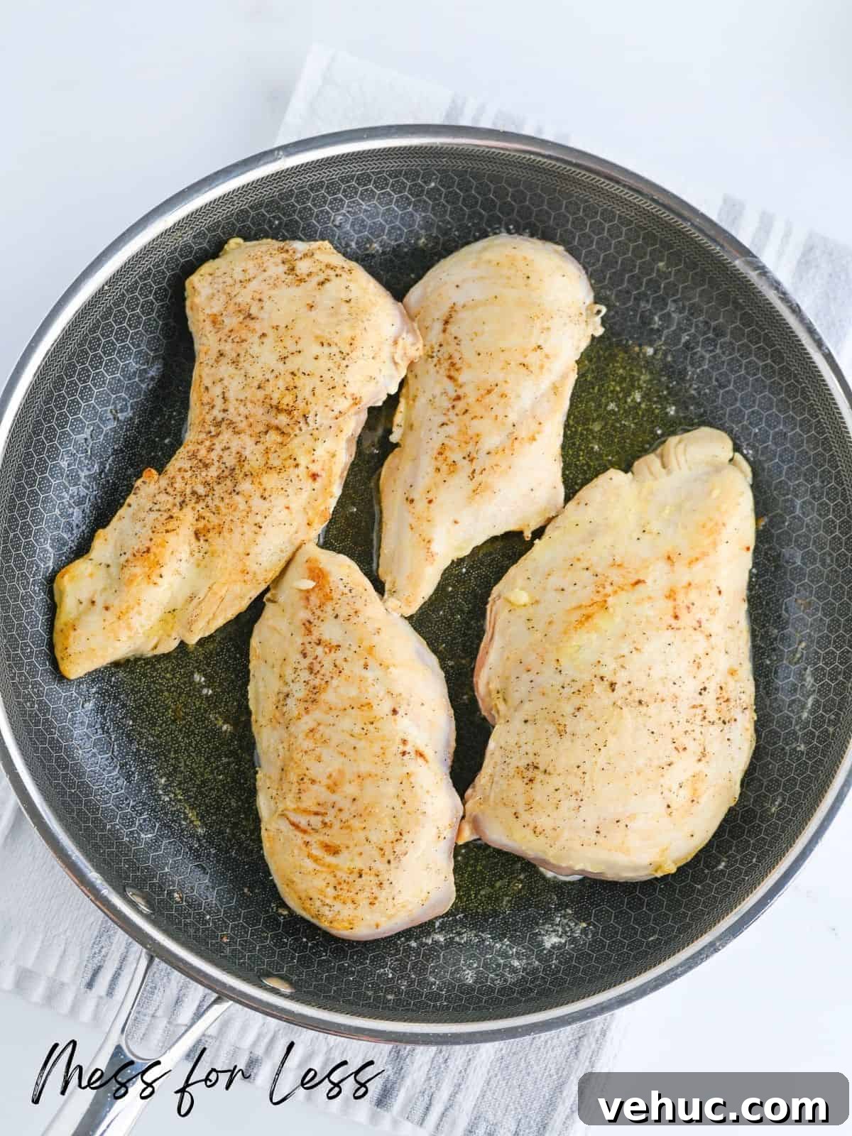 Crockpot Marry Me Chicken Recipe for Tender, Creamy Flavor 5 cooking chicken breasts in frying pan