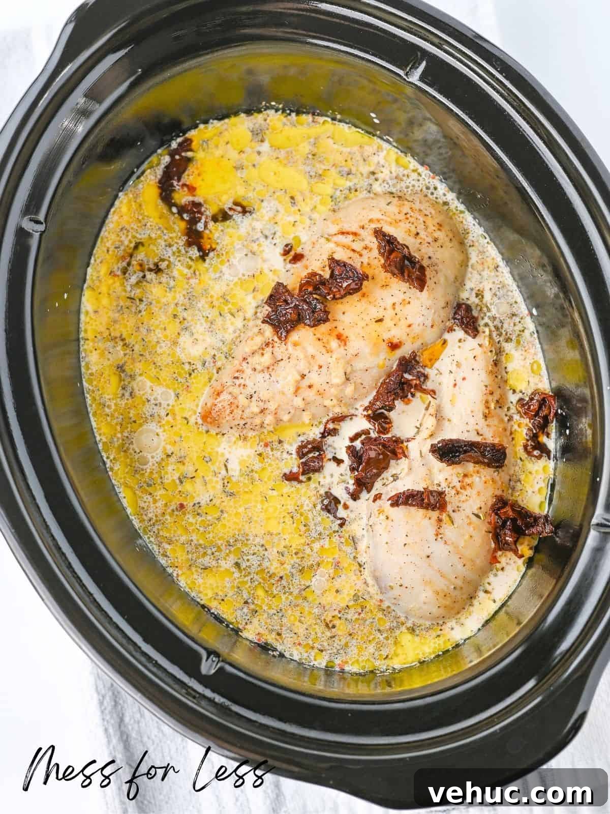 Crockpot Marry Me Chicken Recipe for Tender, Creamy Flavor 9 chicken in cheese sauce with sun dried tomatoes in slow cooker