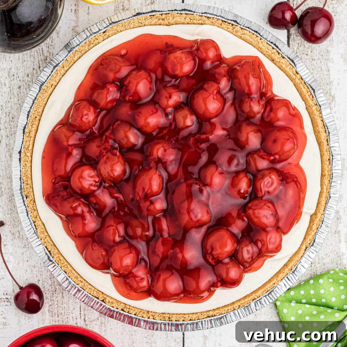 Close up overhead shot of a no bake cherry pie with a graham cracker crust.