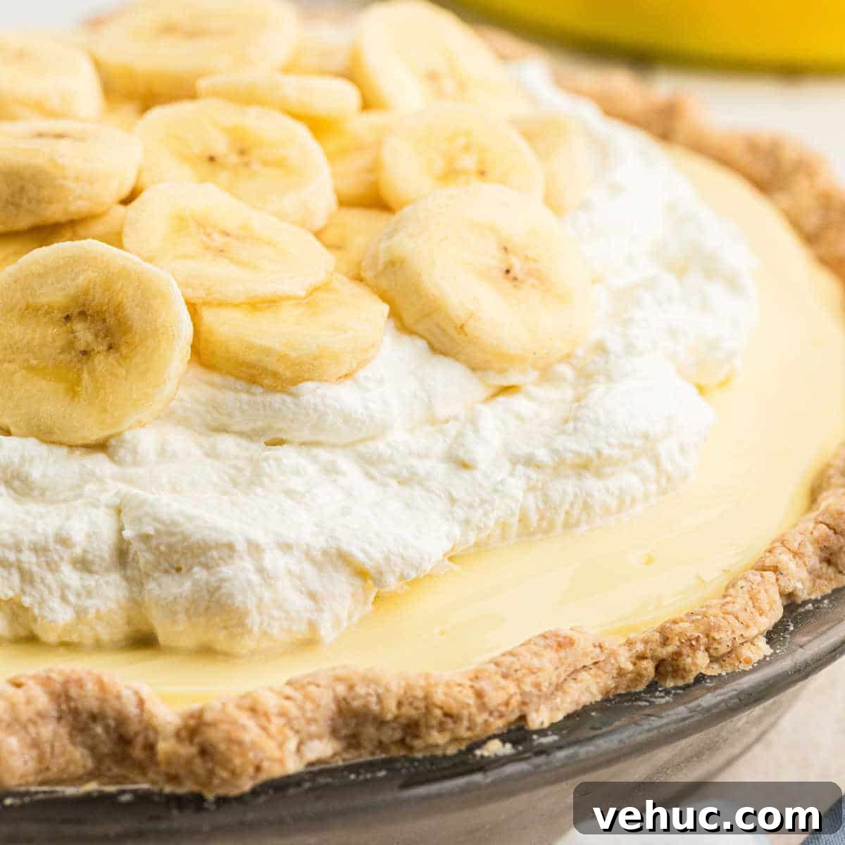 A dish with banana cream pie, cropped square.