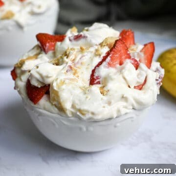 a bowl of strawberry banana cheesecake salad.