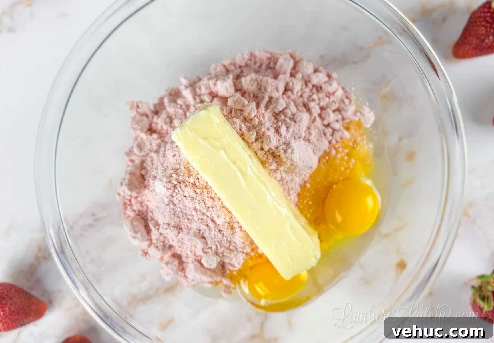 Strawberry Cheesecake Cookies Made with Cake Mix 4 strawberry cake mix, butter, and eggs in bowl.