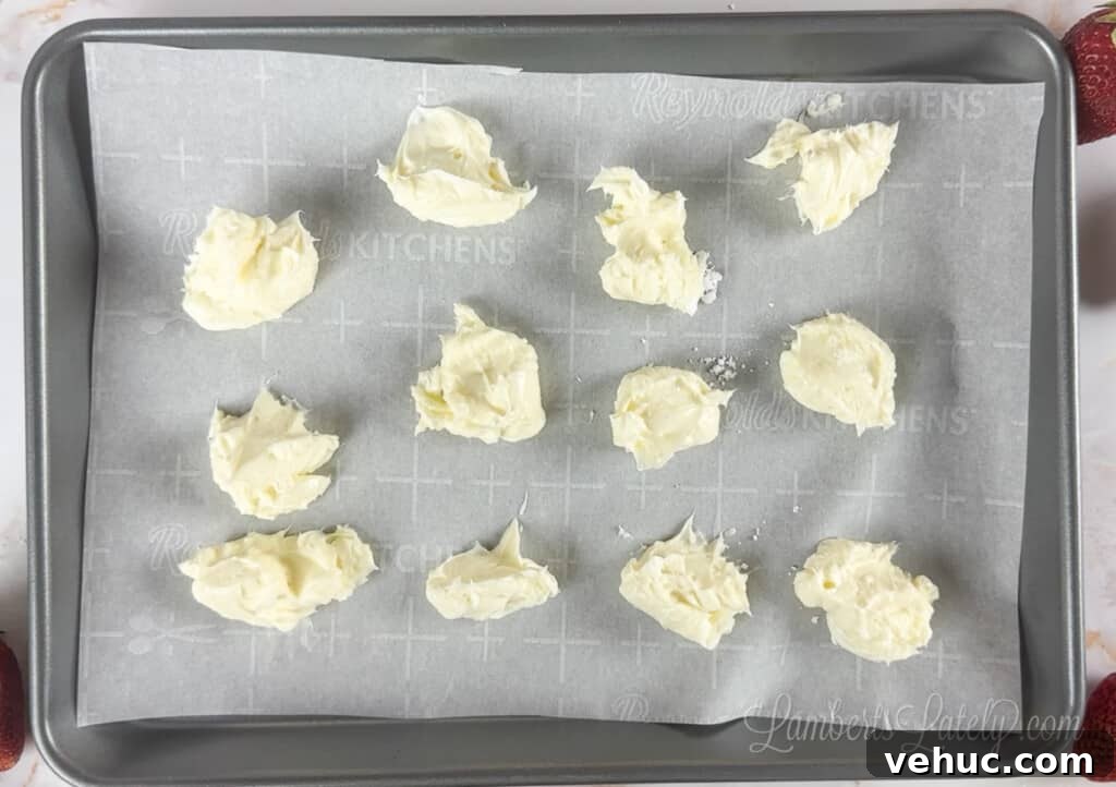 Strawberry Cheesecake Cookies Made with Cake Mix 5 cream cheese tablespoons on a cookie sheet.