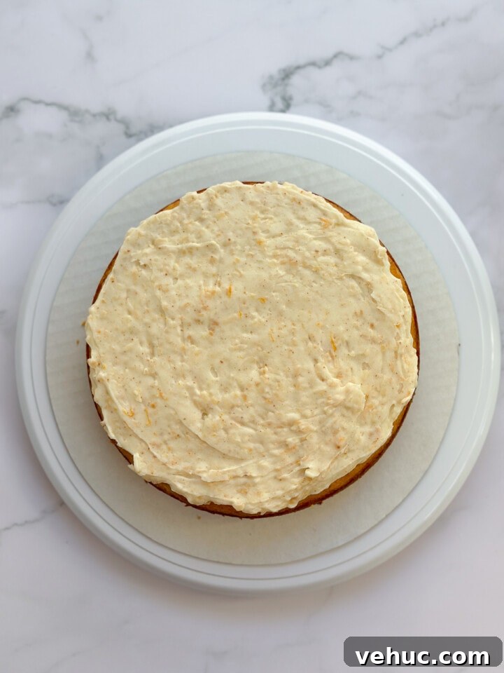 Moist Orange Coconut Cake Recipe with Zesty Glaze 13 single layer of orange coconut cake with frosting on top.
