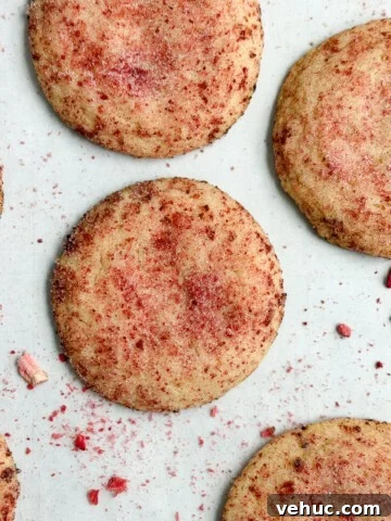 strawberry doodle cookies on a cookie sheet.