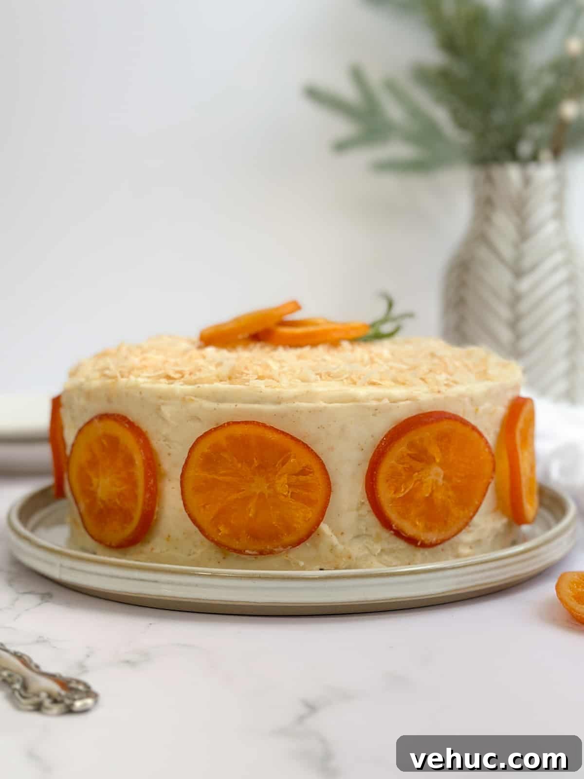 Moist Orange Coconut Cake Recipe with Zesty Glaze 4 a side view of the whole orange coconut cake.