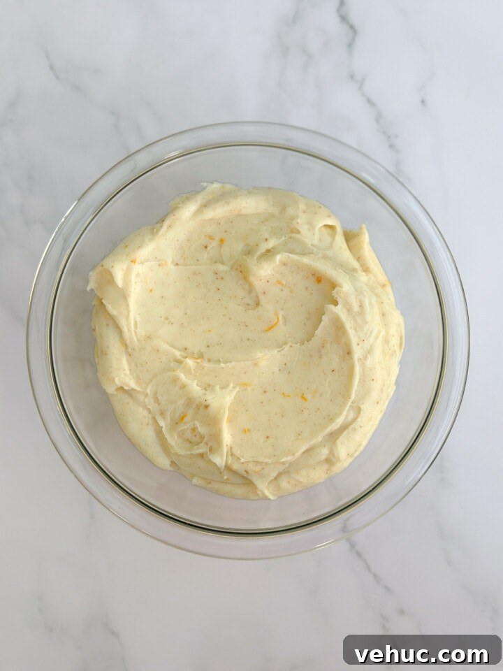 Moist Orange Coconut Cake Recipe with Zesty Glaze 10 frosting all mixed together.