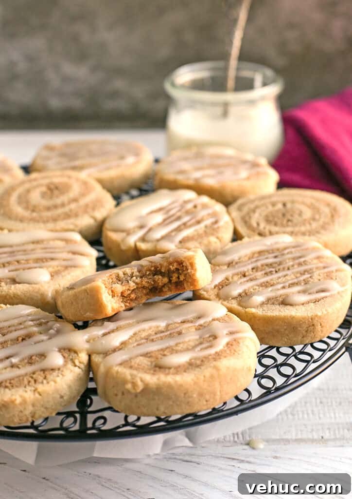 Paleo Cinnamon Roll Cookie Recipe — Soft, Low-Carb Treats 8 paleo cinnamon roll cookies on a cooling rack