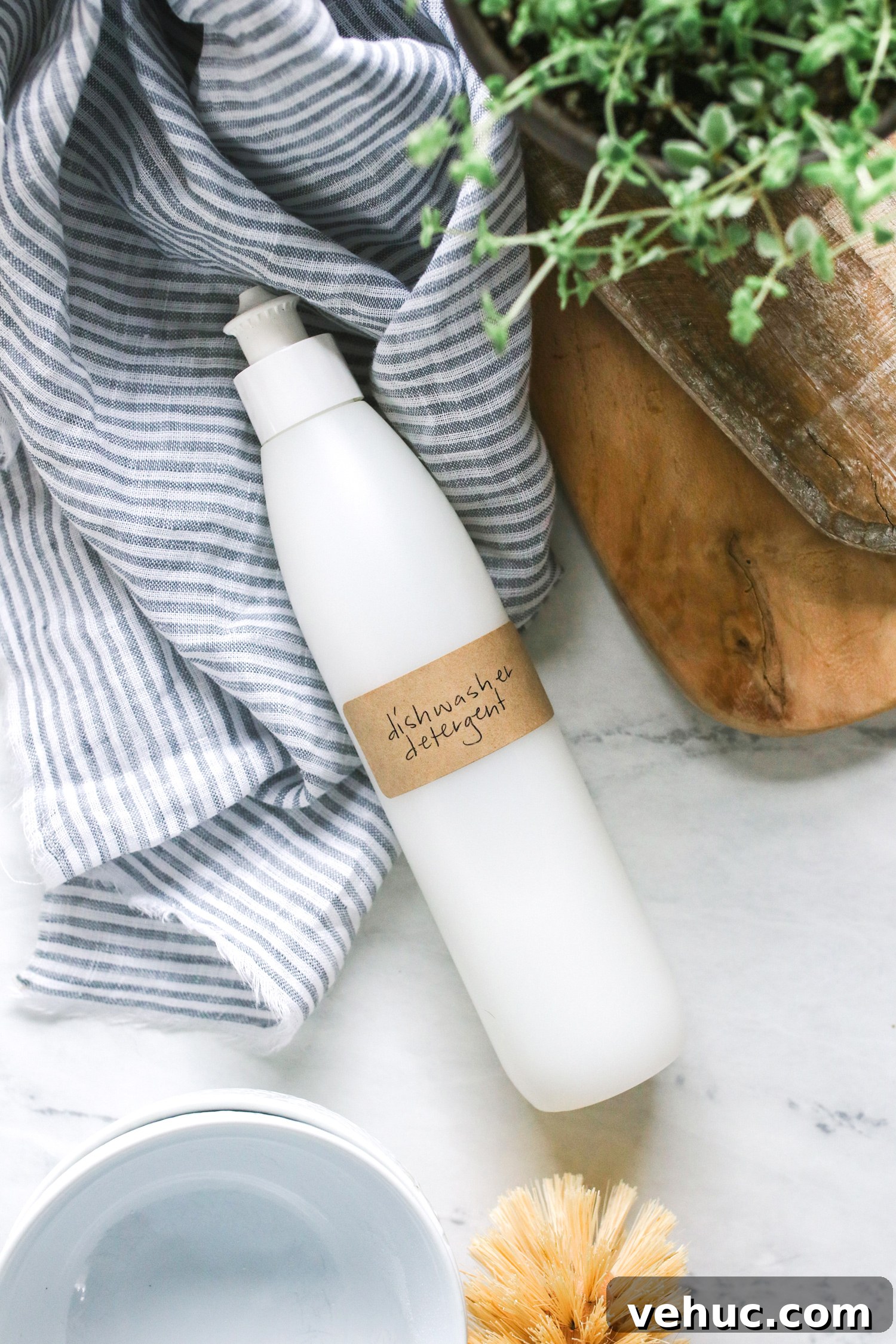 DIY Liquid Dishwasher Detergent with Essential Oils Guide 4 This homemade liquid dishwasher detergent is made with natural ingredients like washing soda and essential oils to get dishes clean without the chemicals.