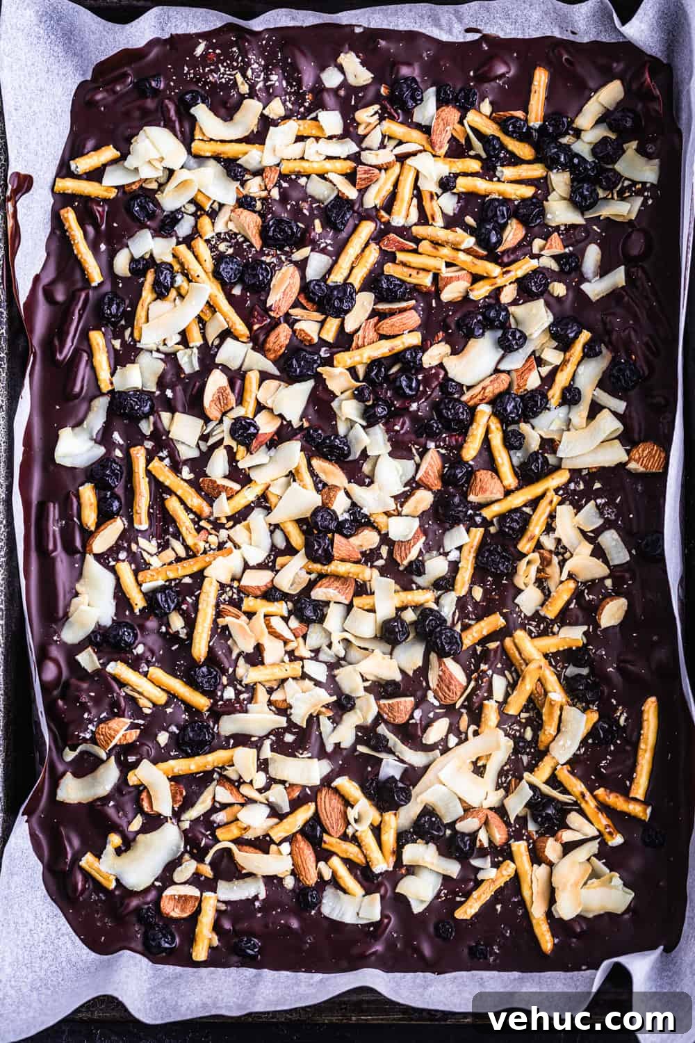 Chocolate Bark Recipe: How to Pick Delicious Toppings 3 Chocolate bark with shredded coconut, pretzels, almonds and dried blueberries.