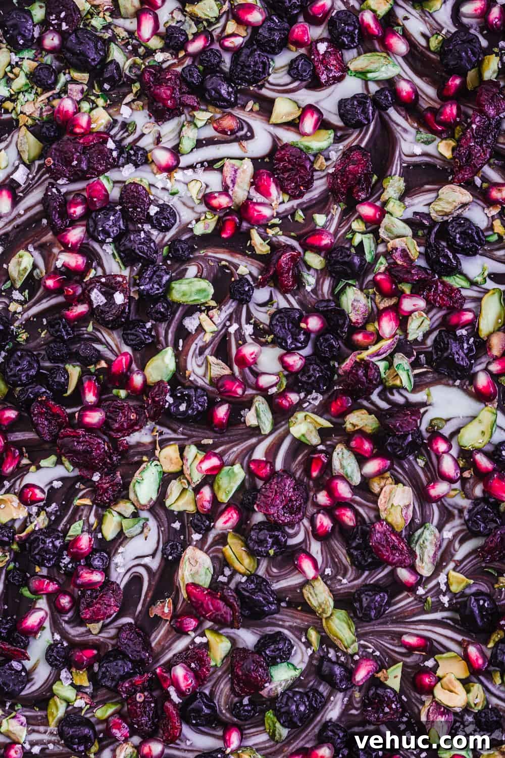 Chocolate Bark Recipe: How to Pick Delicious Toppings 4 Dark and white chocolate bark with pistachios, dried cherries, pomegranate seeds, and flaky sea salt.