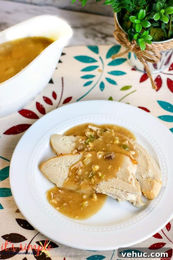 Savory Turkey Giblet Gravy Recipe for Holiday Feasts 5 slices of turkey on white plate.